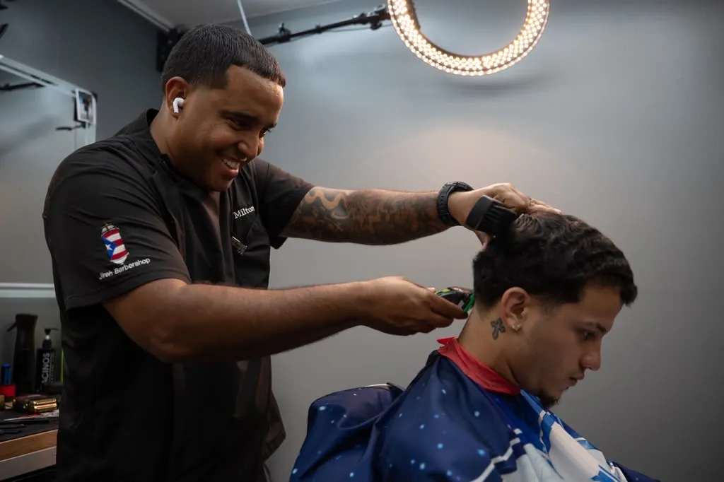 Milton doing clipper work under the ring light